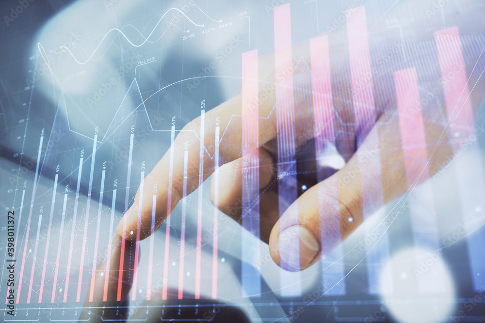 Wall mural multi exposure of man's hands holding and using a phone and financial chart drawing. market analysis