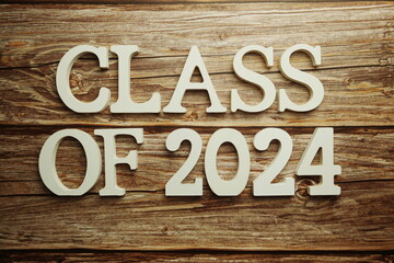 Class of 2024 word alphabet letters on wooden background