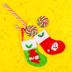 Christmas and New Years concept. Christmas Socks and lollipops, candy kane. Top view, copy space. Square
