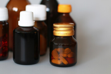 dark-colored medical bottles for storing tablets, capsules, powders, syrup