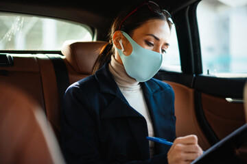 Concentrated business woman sitting in a car