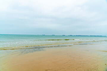 Sea and sand under a blue sky