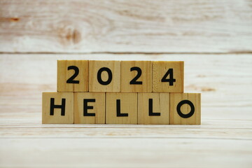 Hello 2024 alphabet letter on wooden background