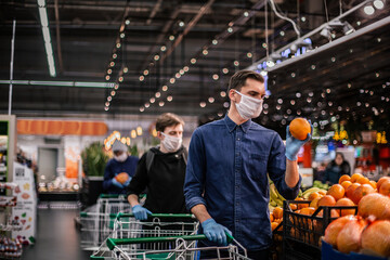 close up. lots of oranges on the supermarket shelf.