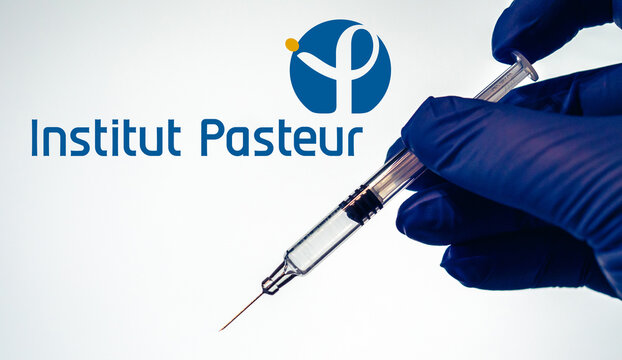 Institut Pasteur Covid-19 Vaccine - Doctor's hand holding syringe containing vaccine against coronavirus disease Covid19 - protection against global pandemic - France, december 8 2020