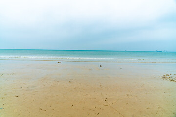 Sea and sand under a blue sky