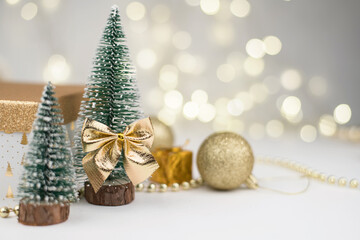 Christmas attributes, Christmas tree decor, gifts on the background of Golden bokeh, New year 2021