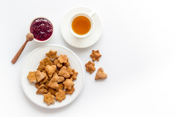 Breakfast with cookies berry jam and tea