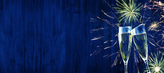 Happy New Year - Silvester background banner - sparklers, firework champagne glasses toast and...