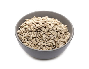 Peeled sunflower seeds in porcelain bowl isolated on white background
