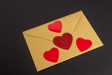 envelope with hearts isolated on black