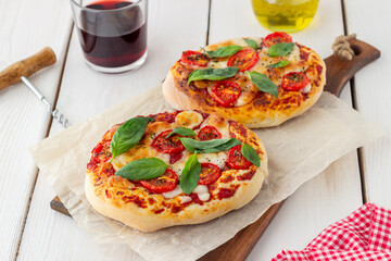 Italian focaccia or pizza with mozzarella, tomatoes and basil. Healthy eating. Vegetarian food.