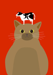 牛を頭の上に乗せる茶色い猫　丑年