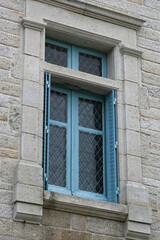 window in rochefort-en-terre in brittany (france)