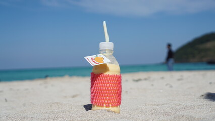 Mango yogurt on a beach