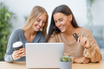 women doing online purchases