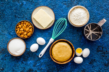 Baking homemade cake or cookie - dough in bowl with ingredients, top view