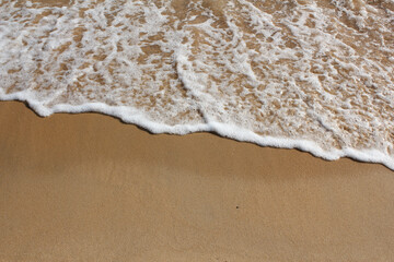 Sand beach and spume
