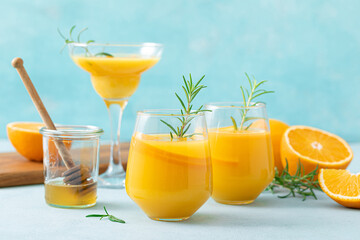 Summer refreshing honey bourbon cocktail with rosemary and orange juice