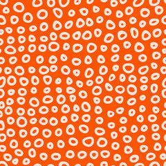 Seamless abstract pattern with rings on orange background. Simple vector illustration for wallpaper; wrapping; surface design