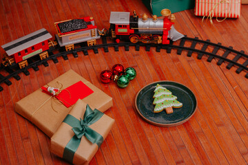 Christmas gifts and and decorated christmas cookie