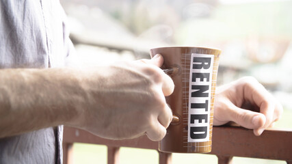 Person drinking coffee from rented mug