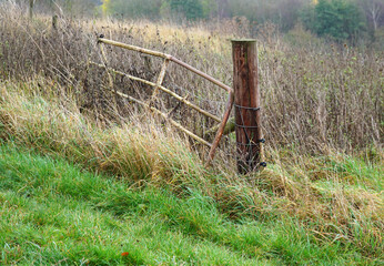 Fototapeta premium Old battered metal farm gate example