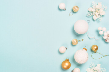 Christmas copmosition with holidays decorations. Flat lay image on blue background.