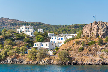 Fototapeta na wymiar Skala Village view from sea in Patmos Island. Patmos Island is populer tourist destination in Greece.