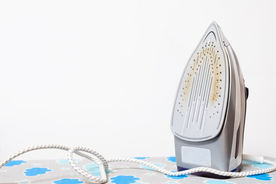 Steam iron with dirty surface with copy space