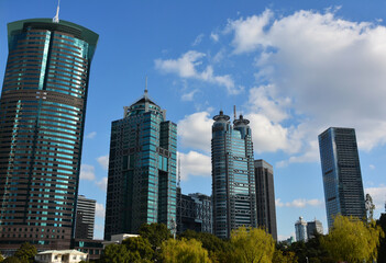 Fototapeta na wymiar several green exterior buildings under blue sky in sunny afternoon 