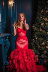 Christmas party, modern woman celebrate,  lifestyle. Girl in luxury red dress with feathers, inspirations and New Year