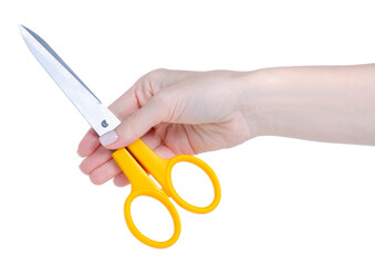 Yellow scissors in hand on white background isolation