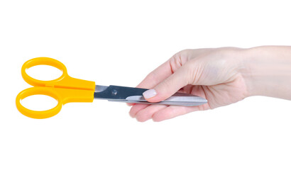 Yellow scissors in hand on white background isolation