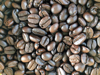 Roasted and dried coffee beans background.