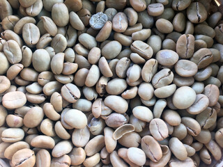 Roasted and dried coffee beans background.