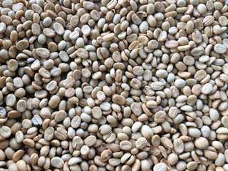 Roasted and dried coffee beans background.