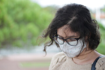 portrait of a young woman with a face mask 