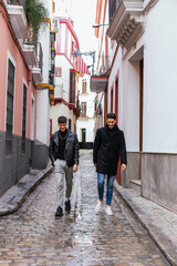 two white men in winter walking down the street