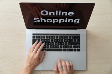 using laptop and credit card online shopping