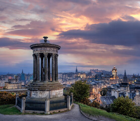 Panorama of Edinburgh against sunset with Calton Hill and Edinburgh castle in Scotland, United Kingdom
