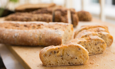 fresh loaf of bread on wooden board