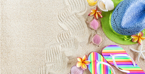 Fototapeta na wymiar ..Blue and green straw Hat and colorful Flip Flops in the sand with shells and frangipani flowers. Summertime on beach concept, copy space ..