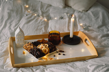 Assorted dried fruits on a tray in a living room. Dietary nutrition. Natural and healthy snack food