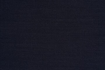 dark blue texture close-up knitted or woolly fabric for background or wallpaper