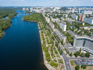 Aerial drone view. Residential buildings on the bank of the canal on a sunny day in Kiev.