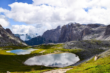 Naklejka na ściany i meble Beautiful Italy's Dolomites region in Italy with mountain lake view in summer