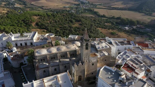 Views of Vejer de la Frontera seen from above. Aerial footage of church and white andalusian town