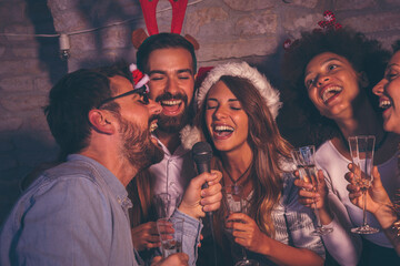 Friends singing karaoke for New Year's Eve