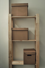 Paper boxes are on a wooden rack. Archive storage, use of eco-friendly materials